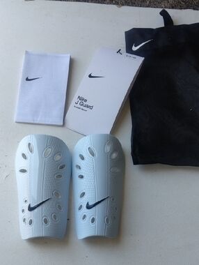 Nike White Soccer Shin Guards with Black Swoosh